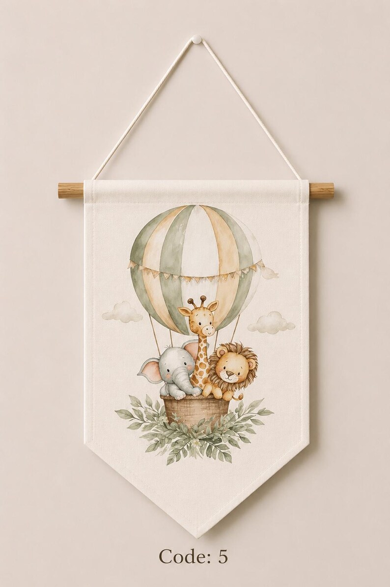 May include: A cream-colored fabric wall hanging featuring a watercolor illustration of a hot air balloon with green and beige stripes. Inside the basket are a gray elephant, a yellow giraffe, and a brown lion. Green leaves surround the base. Code: 5.