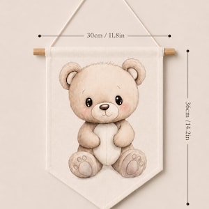 May include: A beige fabric wall banner featuring a brown teddy bear illustration. The banner measures 11.8 inches wide by 14.2 inches high and hangs from a wooden rod. Text at the bottom reads: Please write the number of the banner design you want in the personalization box. ( 1, 2, 3, 4, 5, 6, 7, 8 )