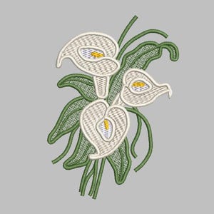 May include: Embroidered design of calla lilies. The white flowers have yellow centers and are surrounded by green leaves and stems. The design is detailed with a textured, stitched appearance, set against a gray background.