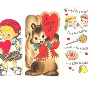 May include: Three vintage Valentine's Day cards. The first card features a girl holding a red heart and two kittens. The second card features a squirrel holding a red heart with the text "A Valentine HI". The third card features two children with the text "Wouldja for a PENNY? Or a LOLLIPOP? Wouldja for a COOKIE? Or a LEMON DROP?"