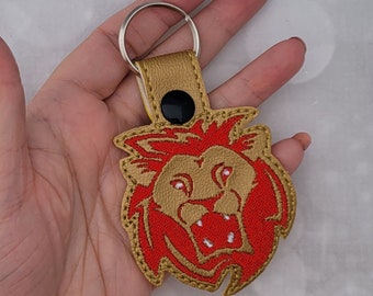 Porte-clés mascotte lion en vinyle marin imitation cuir - Unique et élégant