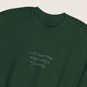 If My Symptoms Were Visible I’d Glow Sweater | Geborduurde Unisex Trui | Spoonie | Chronische Aandoening | Onzichtbare Beperking