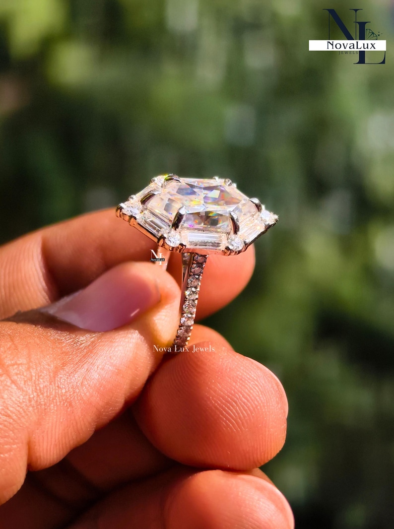 A high-resolution macro photography shot of the brilliant Dutch marquise moissanite center stone. The sunlight highlights the unique hexagon faceting and exceptional VVS1 clarity, casting dazzling light reflections and intense fire. The secure prongs and hidden micro-pave detailing are shown in high resolution, proving the premium materials and precise setting techniques used for this high-end proposal ring
