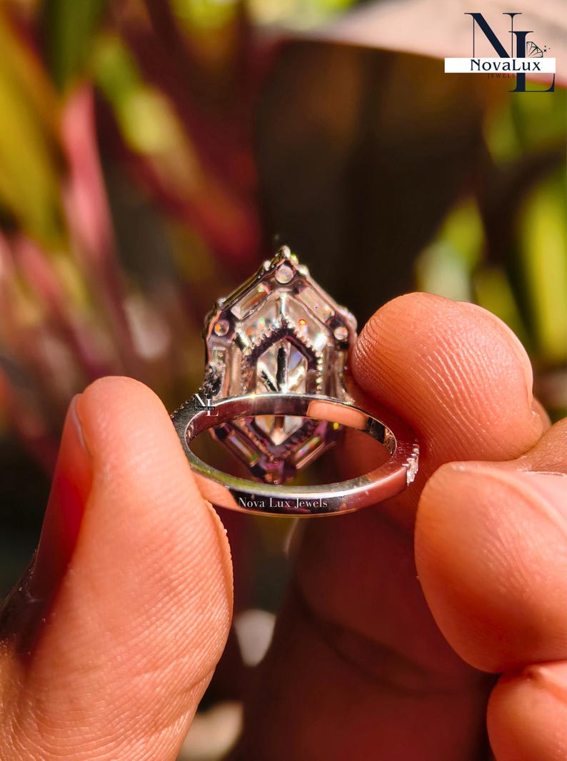 A perfectly centered top-down shot of the Dutch marquise ring, emphasizing its geometric symmetry and balanced proportions. The 6-prong setting remains clean and understated, allowing the large surface area of the unique cut to remain the focal point. This angle highlights the modern Art Deco influence and the architectural silhouette favored by modern jewelry lovers in 2026.