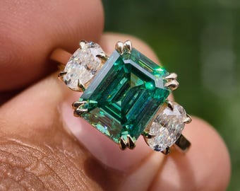 Green Emerald Cut Moissanite Engagement Ring, Double Prong Three Stone Ring, Oval Side Stone 14k Solid Gold Bridal Jewelry, Trilogy Ring
