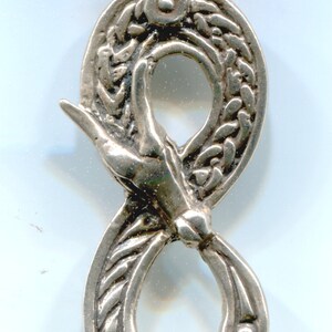 May include: Silver pendant in the shape of an infinity symbol with a snake design. The snake is curled around the symbol, with its head and tail meeting in the center.