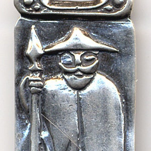 May include: A silver pendant featuring a stylized figure of a man wearing a hat and holding a spear. The pendant has a decorative top with a Celtic knot design.