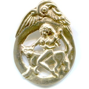 May include: A gold-toned pendant featuring a woman riding a mythical creature with wings. The pendant is intricately detailed and has a cutout design.