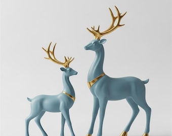 May include: Two standing deer figurines in a matte blue finish with metallic gold antlers and neck collars. The text STL 3D DIGITAL FILE is visible at the top. These decorative sculptures feature smooth, stylized bodies and pointed hooves.
