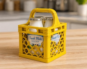 May include: A yellow plastic milk crate holding two glass milk bottles with silver lids. The crate has a handle and a honeycomb design. The bottles have labels that read "Fresh Milk Whole Milk". The crate is sitting on a wooden surface.