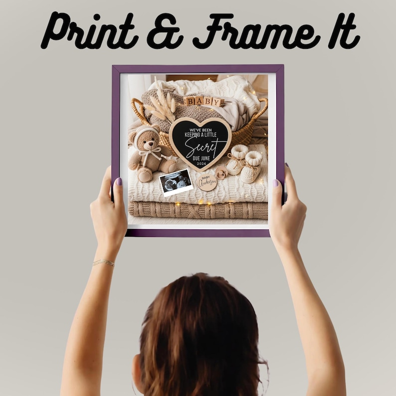 May include: A framed announcement with the text "Print & Frame It". Inside the frame is a basket with baby items, including a teddy bear, booties, and a heart-shaped sign that reads "We've been keeping a little secret due June 2026".