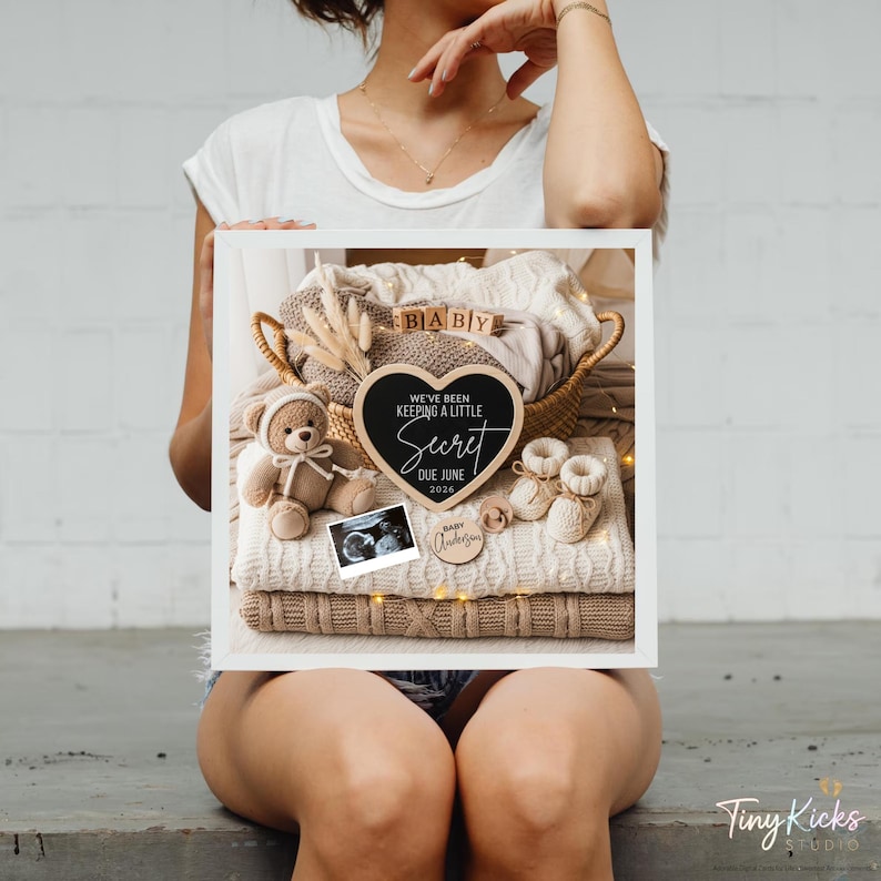 May include: A framed pregnancy announcement with a stack of folded blankets, a teddy bear, baby booties, and a sonogram. A heart-shaped chalkboard reads "We've been keeping a little secret, due June 2024." A small wooden sign says "Baby Anderson."