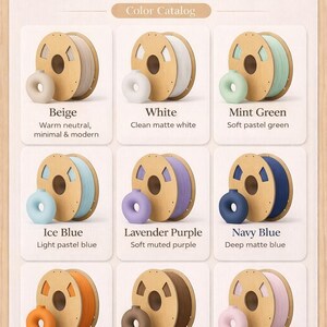 May include: A color catalog showcasing nine matte PLA filament colors. Colors include beige, white, mint green, ice blue, lavender purple, navy blue, orange, earth brown, and baby pink. Each color is displayed with a spool of filament and a small donut-shaped sample.