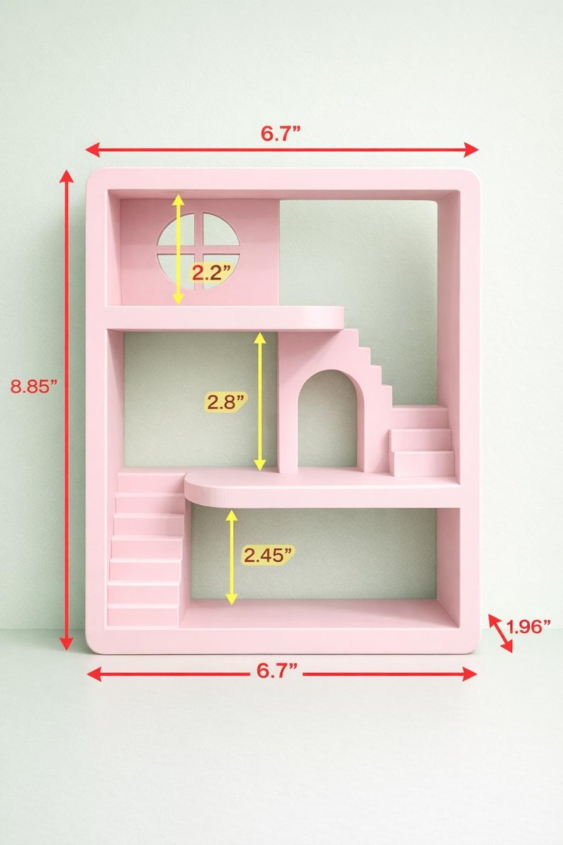 May include: A pink dollhouse-style shelf unit with multiple levels, stairs, and an arched doorway. The unit is 6.7 inches wide, 8.85 inches tall, and 1.96 inches deep. It features a window with a cross design and a rounded top.