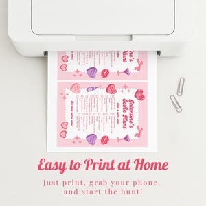 May include: A pink Valentine's Selfie Hunt printable sheet is being printed from a white printer. The sheet has a decorative border with hearts, lips, and cocktail glasses. The text "Easy to Print at Home" is at the bottom.