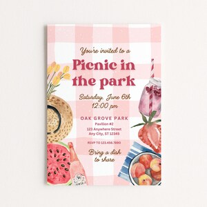 May include: A watercolor picnic invitation with a pink gingham background. The text "Picnic in the park" is in a bold, red font. Illustrations include a straw hat, watermelon, peaches, and a jar of pink lemonade. The invitation includes the date, time, and location.