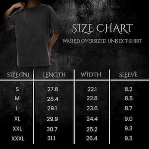 May include: A size chart for a washed oversized unisex t-shirt. The chart displays measurements in inches for sizes S through XXXL. The shirt is dark gray and appears to be worn. The chart includes length, width, and sleeve measurements.