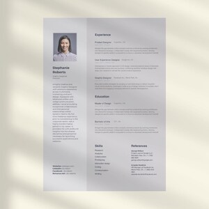 May include: A resume with a photo of Stephanie Roberts, a graphic designer. The resume lists experience, education, skills, and references. The resume is printed on a light gray background.