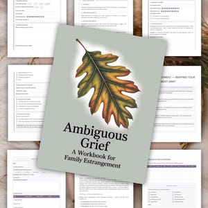 May include: A workbook titled Ambiguous Grief: A Workbook for Family Estrangement with a sage green cover featuring a large, detailed illustration of an oak leaf transitioning from green to yellow and orange, surrounded by several white pages of text.
