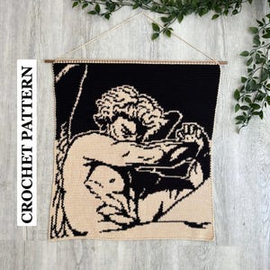 May include: A rectangular crochet wall hanging featuring a black and beige graphic design of a figure with curly hair, hunched over with arms crossed. The piece is suspended from a wooden dowel with a string. The text CROCHET PATTERN is visible.