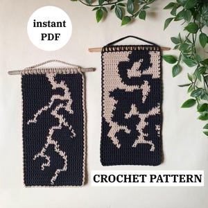May include: Two black and beige crochet wall hangings with abstract designs, suspended from wooden dowels. The text "instant PDF" is in a white circle. The words "CROCHET PATTERN" are at the bottom.