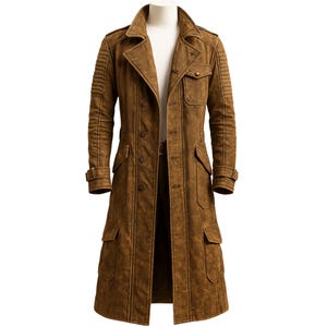 May include: A long, brown suede coat in a classic trench coat style. It has a notched collar, button closure, multiple pockets, and decorative stitching on the shoulders and sleeves. The coat is displayed on a mannequin.