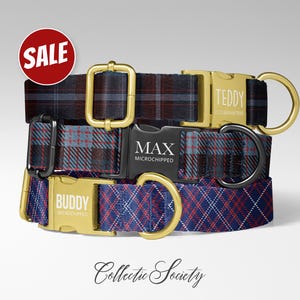 May include: Three plaid dog collars in navy, red, and gray with gold and black hardware. Each collar has a name engraved on the buckle: "TEDDY", "MAX", and "BUDDY". A red "SALE" sticker is in the upper left corner.