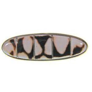 May include: Oval-shaped hair clip with a segmented design. The clip features a pattern of black and tan shapes set within a silver-toned metal frame. The segments are arranged in a row, creating a unique accessory.
