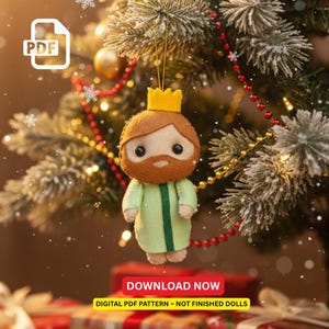 May include: A felt Christmas ornament shaped like a king, with a brown beard and a gold crown. The king wears a light green robe with a dark green stripe. The ornament hangs from a Christmas tree decorated with red and gold beads and lights. The image includes the text "DOWNLOAD NOW".