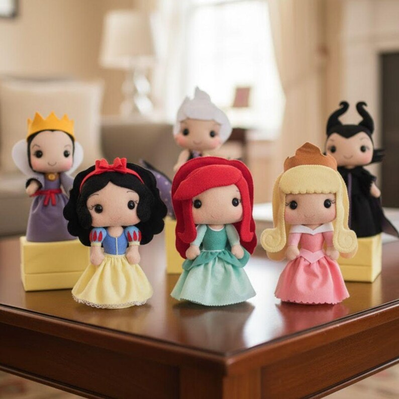 May include: A collection of handmade felt dolls depicting various fairytale characters. The dolls feature detailed costumes and accessories, including crowns, dresses, and distinctive hairstyles. The dolls are displayed on small yellow platforms.