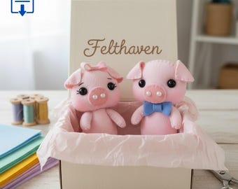May include: Two handmade felt pig figurines inside a cream-colored gift box with the text Felthaven printed on the lid. The left pig features a small bow on its head, while the right pig wears a blue bow tie. Both pigs have black eyes.