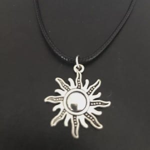 Sun Charm Leather Cord Necklace: Tibetan Silver Pendant