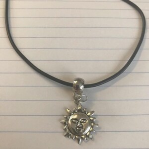 Sun Charm Leather Cord Necklace: Tibetan Silver Pendant