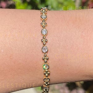 18 kt gouden moissaniet tennisarmband: vintage sieraden met ring