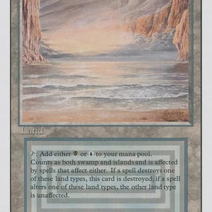 May include: A rectangular trading card titled Underground Sea featuring a landscape illustration of a coastal scene with cliffs and a calm ocean. The card text includes game rules for adding mana and land type interactions, with the artist credit Rob Alexander.