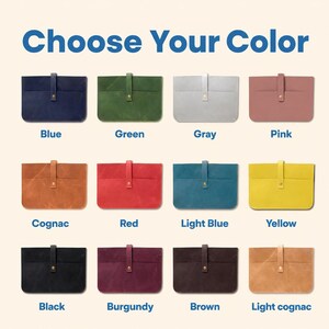 May include: A selection of leather laptop sleeves in various colors, including blue, green, gray, pink, cognac, red, light blue, yellow, black, burgundy, brown, and light cognac. Each sleeve has a flap closure.