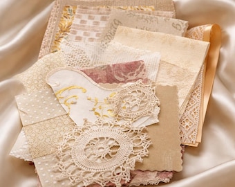 Bundel goudbruine stofresten, kant, kleedjes, benodigdheden voor tijdschriften