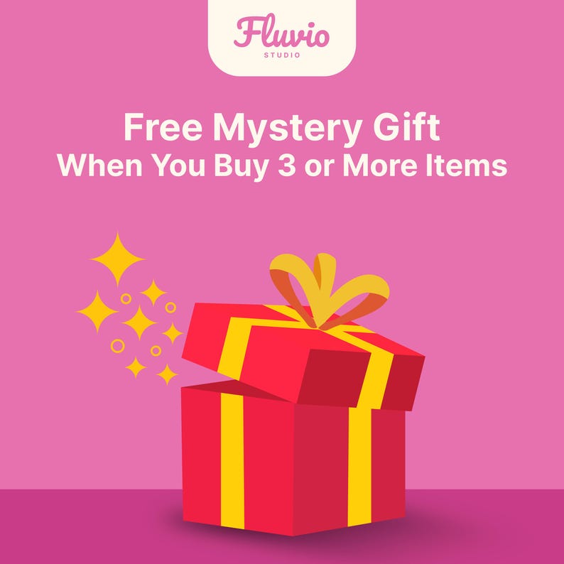 May include: A red gift box with yellow ribbon and accents, set against a pink background. The text "Free Mystery Gift When You Buy 3 or More Items" is displayed above the gift box. Yellow starbursts are on the left.