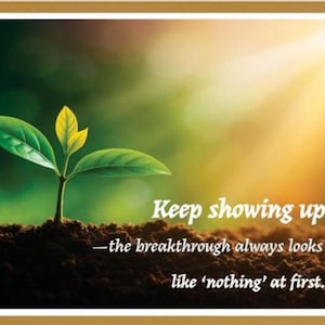May include: A framed print featuring a young plant with green and yellow leaves emerging from soil. The background is a blurred gradient of green and gold. Text reads: "Keep showing up - the breakthrough always looks like 'nothing' at first."