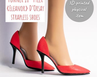 May include: A pair of red d'Orsay strapless shoes for 16-inch Tonner Tyler dolls. The shoes feature a pointed toe and a black stiletto heel. Text on the image reads: Tonner 16" Tyler «Eleanor» D'Orsay strapless shoes and 3D-printed physical item.