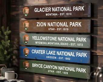 May include: A wall-mounted sign consisting of five horizontal wooden planks, each featuring the National Park Service arrowhead logo, the name of a national park, its state location, and establishment year in white text on a coloured background.