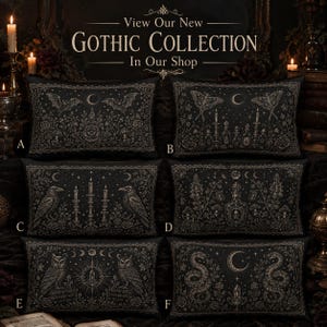 May include: Six rectangular black throw pillows labeled A through F, each featuring intricate gold-toned illustrations of bats, moths, ravens, owls, snakes, candles, and botanical elements. The text View Our New GOTHIC COLLECTION In Our Shop is visible.