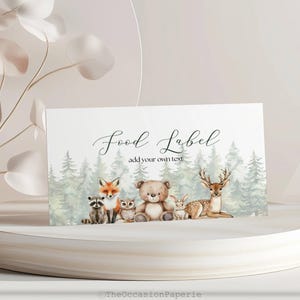 May include: A white food label with the text "Food Label" and "add your own text" in a script font. The label features watercolor illustrations of woodland animals, including a fox, raccoon, owl, bear, rabbit, and deer, with a forest backdrop.