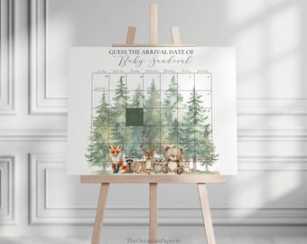 May include: A baby shower game sign on an easel. The sign reads "Guess the Arrival Date of Baby Sandoval" and features a calendar grid with forest illustrations and woodland animal graphics, including a fox, raccoon, deer, and bear.