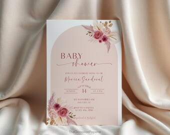 May include: Baby shower invitation with a blush pink background and floral accents. The invitation includes the text "Baby Shower", the name "Monica Sandoval", and event details. The design features a soft, elegant aesthetic.