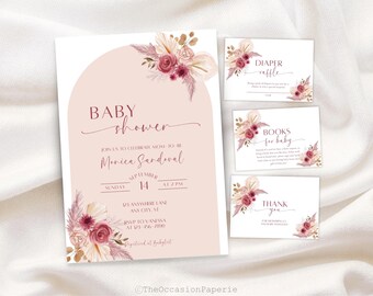 May include: A baby shower invitation suite with a blush pink background and floral accents. The invitation includes details like the date, time, and RSVP information. Coordinating cards for diaper raffle, books for baby, and thank you are also included.