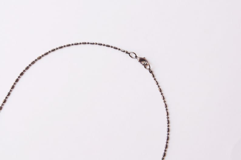 Mapplethorpe Gunmetal Skull Necklace inspired by Patti
