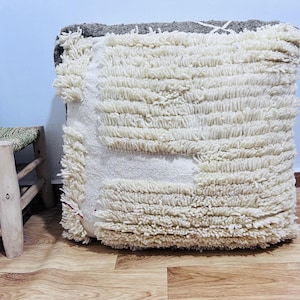 Handwoven Berber Wool Ottoman: Moroccan Pouf - Earthy Tones