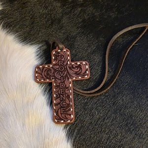 Genuine leather cross rearview mirror decoration. Hand stitched with laser engraved design. White thread.