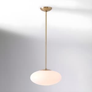 May include: A contemporary pendant light with a brass finish. It features a long, thin rod and a round, frosted glass shade. The light hangs from the ceiling and is suitable for indoor spaces.